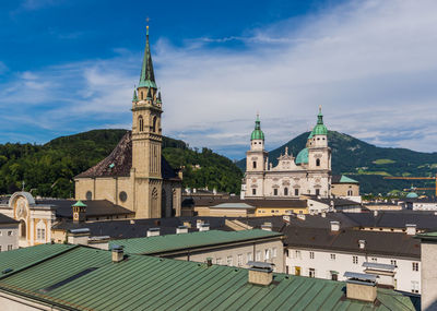 View of buildings in city against sky