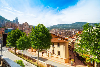 Buildings in town against sky