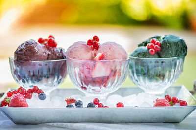 Close-up of fruits in glass bowl on table