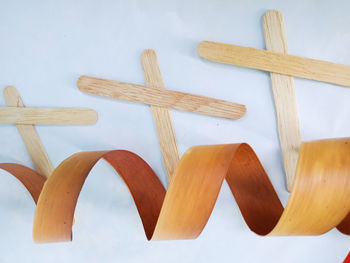 High angle view of bread on table against white background