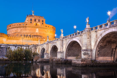 Reflection of building in water at night, castel sant'angelo 