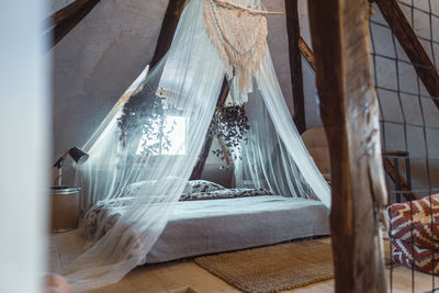 Clothes hanging on glass window at home