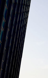 Low angle view of skyscraper against clear sky