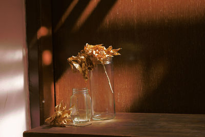 Close-up of glass vase on table at home