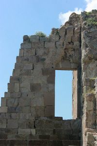 Low angle view of old ruin building against sky