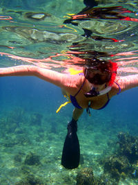Young woman snorkeling in water