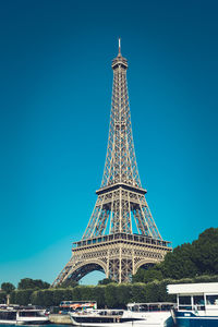 Low angle view of tower against blue sky