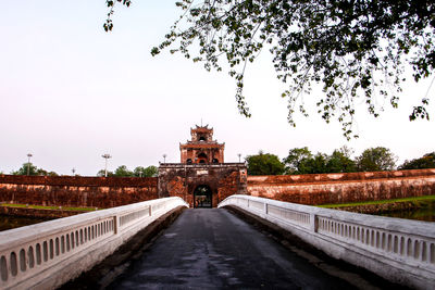 View of bridge in city against clear sky