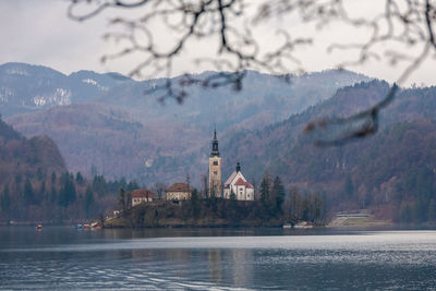 Scenic view of an island with a church against sky