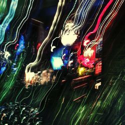 Close-up of light trails on window