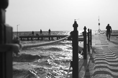 View of built structure by sea