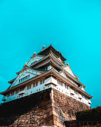 Low angle view of old building against blue sky