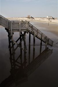 High angle view of pier over lake against sky