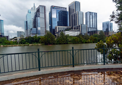 Modern buildings in city against sky