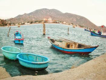 Boats moored on beach