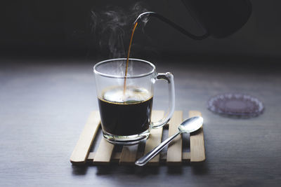 Glass of coffee on table