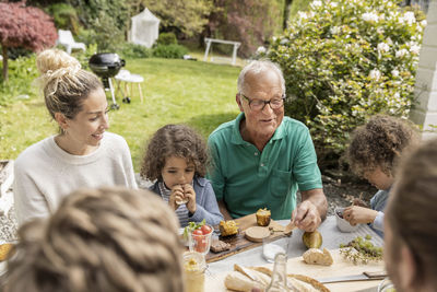 Extended family having lunch in garden