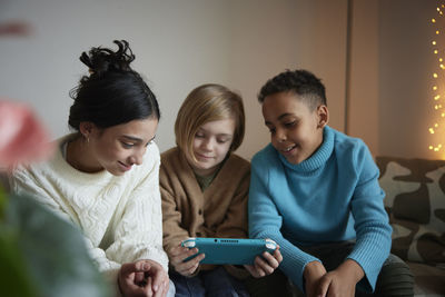 Children playing video games at home