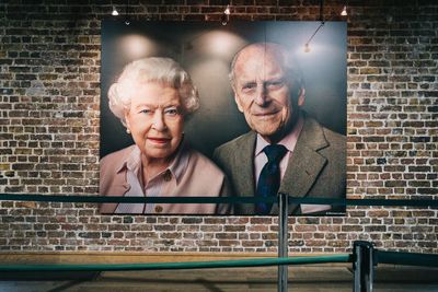 Portrait of friends against wall