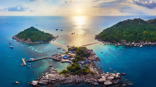 High angle view of rocks in sea against sky