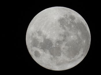 Low angle view of moon against sky at night