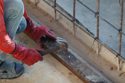 Low section of man working at workshop