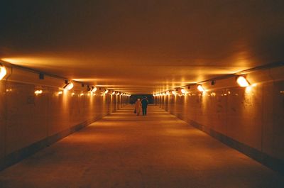 Blurred motion of woman in tunnel