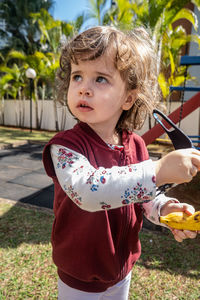 Portrait of cute girl standing outdoors