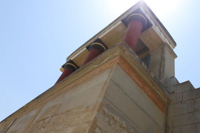 Low angle view of bell tower against sky