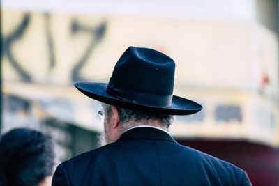 Rear view of man wearing hat