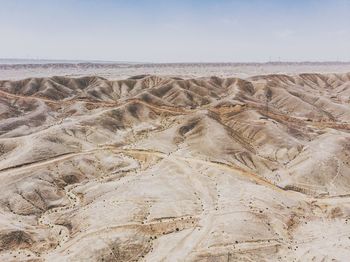 Aerial view of desert against sky