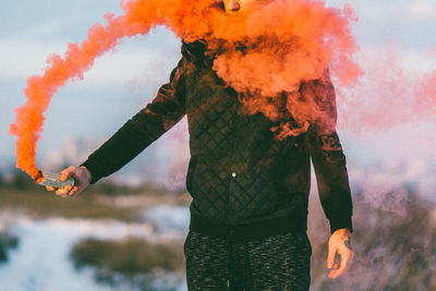 Close-up of man standing against sky