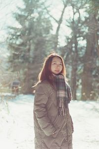 Portrait of a smiling woman in snow