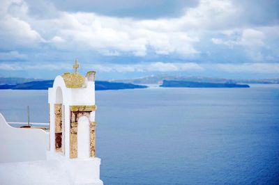 Scenic view of sea against cloudy sky