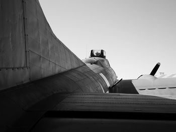 Low angle view of airplane against clear sky