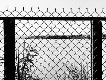 Chainlink fence seen through chainlink fence