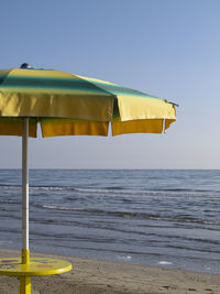 Scenic view of beach against clear sky