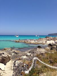 Scenic view of sea against clear blue sky