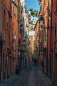 Narrow alley amidst buildings in city