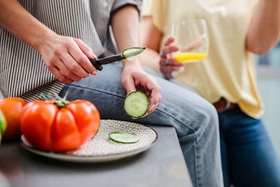 Midsection of man preparing food