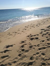 Scenic view of beach against clear sky