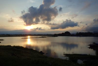 Scenic view of lake at sunset