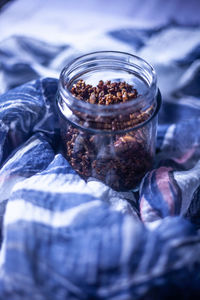 Close-up of ice cream in glass jar on table
