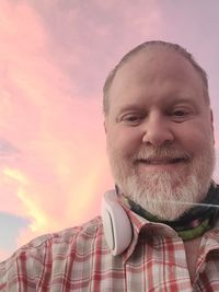 Portrait of a smiling mid adult man against sky