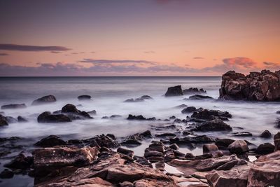 Scenic view of sea against sky during sunset