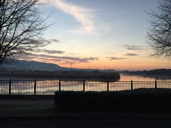 Scenic view of lake against cloudy sky