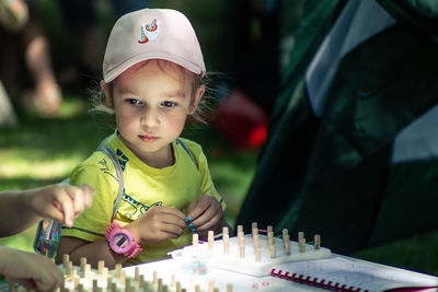 Portrait of cute girl playing