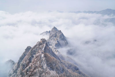 Low angle view of snowcapped mountain against sky