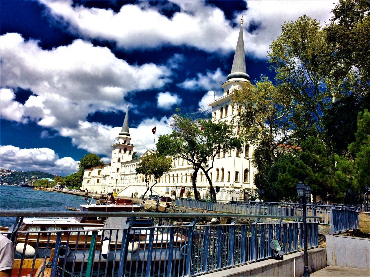 VIEW OF BUILDING AGAINST CLOUDY SKY