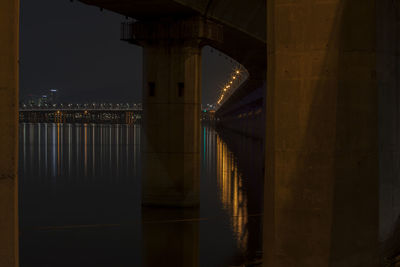 Underneath view of illuminated bridge over river han at night